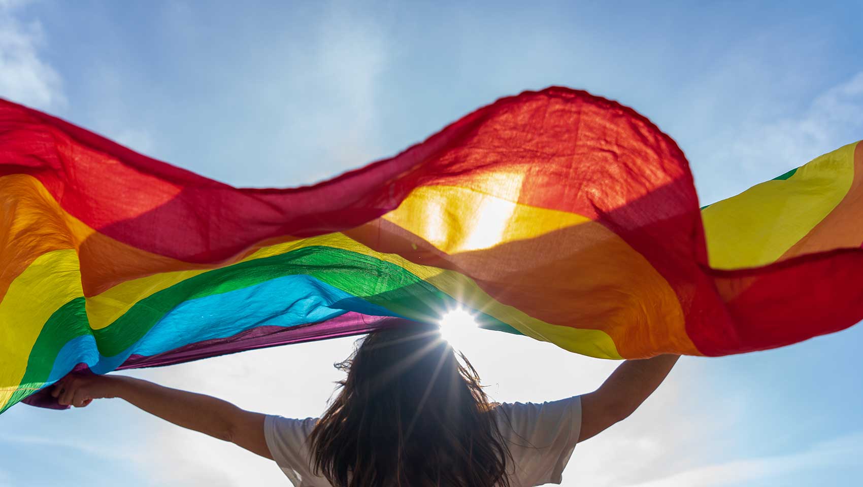 woman holding pride flag
