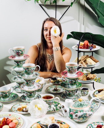 woman with tea and snacks at table at Fontenelle tea Room