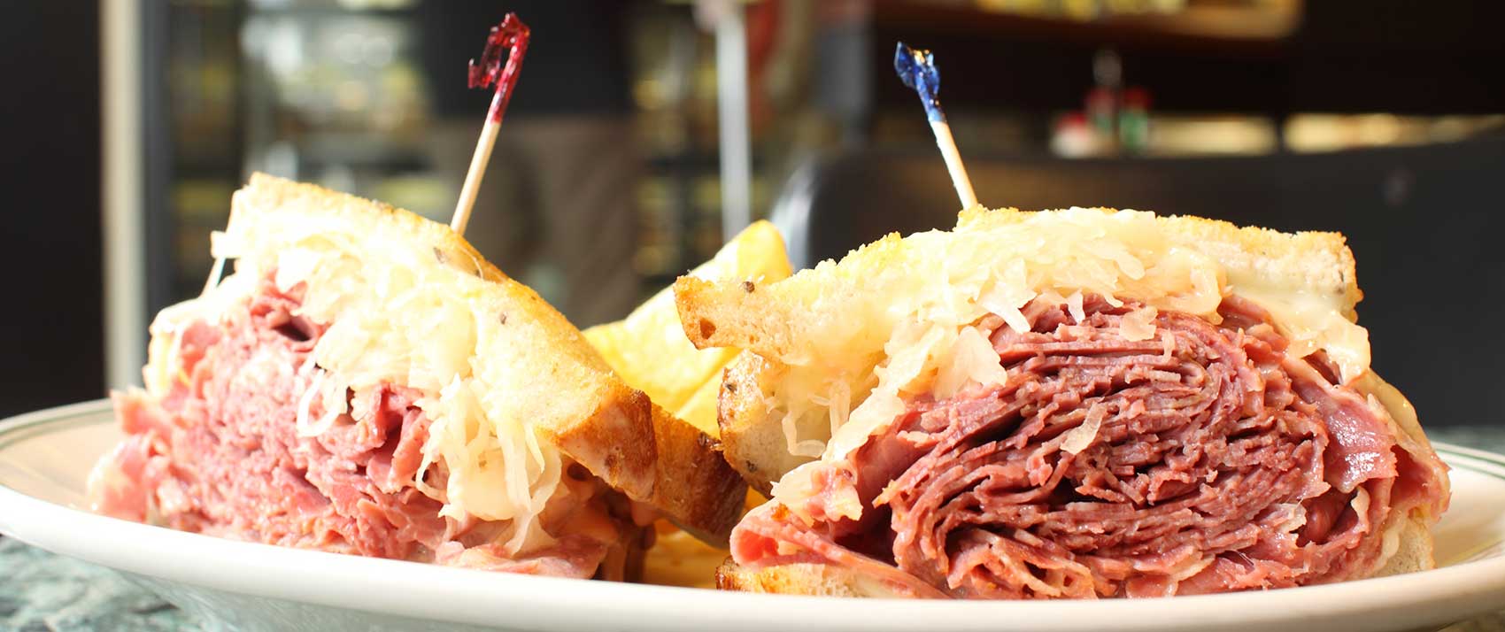 Traditional Reuben sandwich with corned beef, Swiss cheese, and sauerkraut